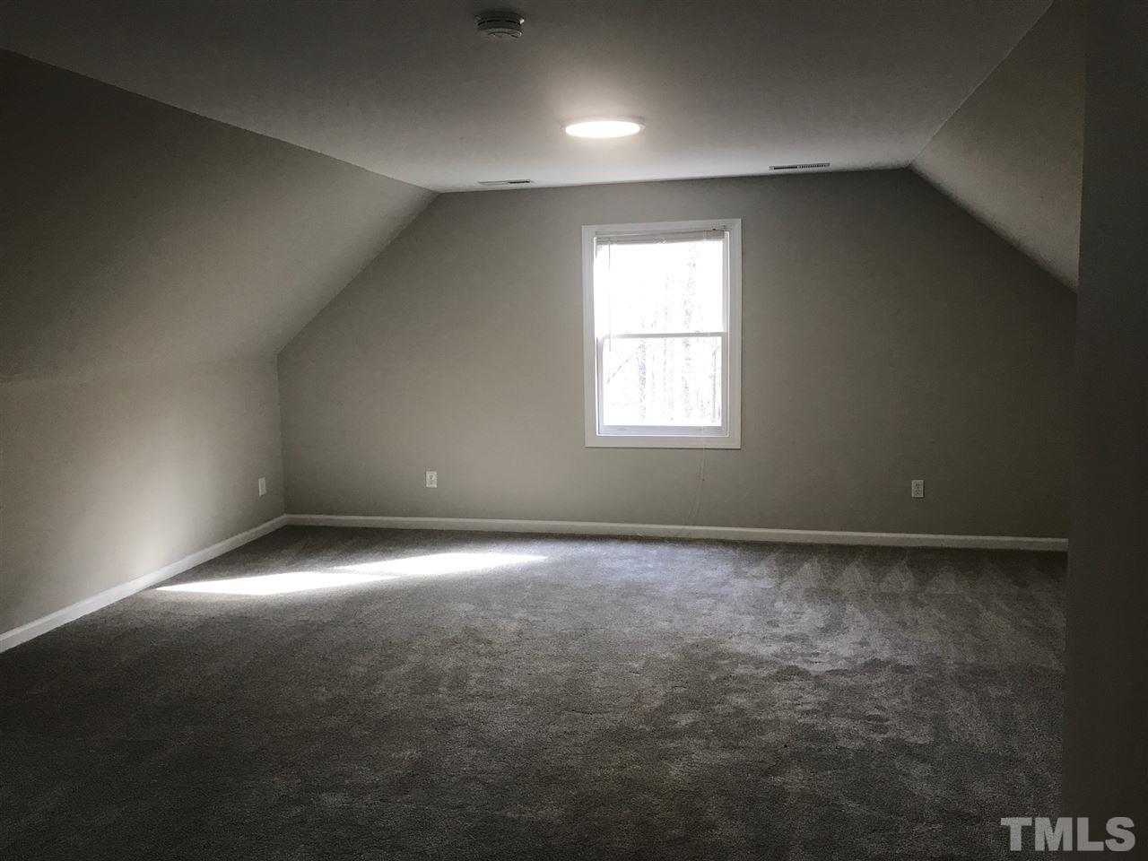 1416 Shadowview Court Raleigh, NC 27614 - Photo 19 of 28 an empty room with a window