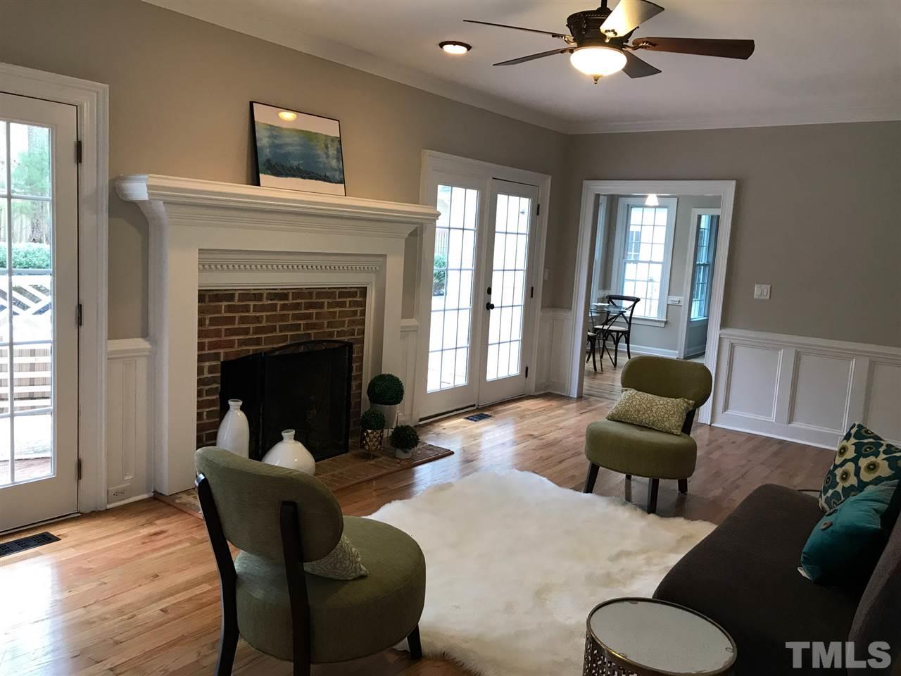 1416 Shadowview Court Raleigh, NC 27614 - Photo 4 of 28 a living room with furniture and a fireplace