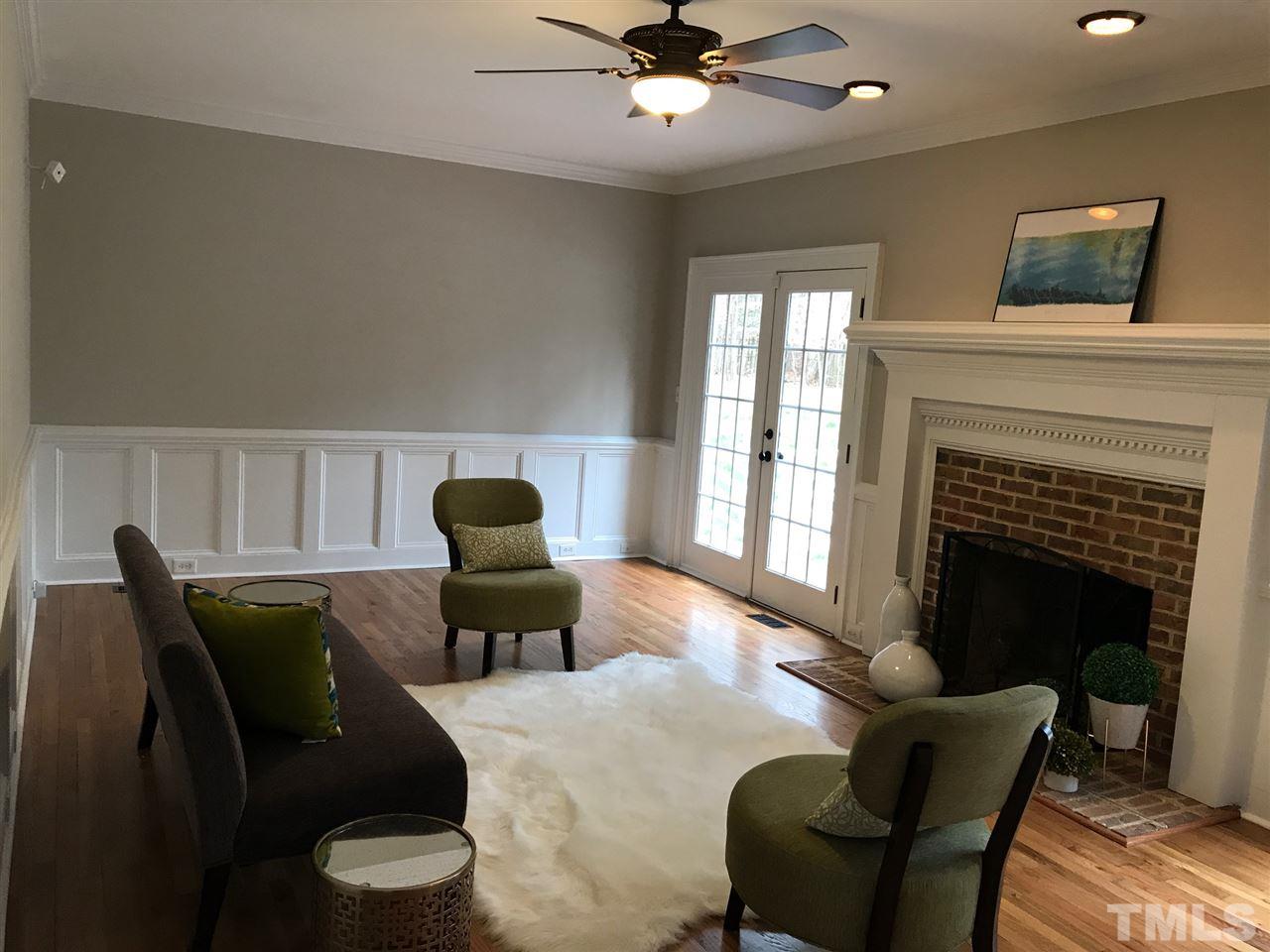 1416 Shadowview Court Raleigh, NC 27614 - Photo 9 of 28 a living room with furniture and a fireplace