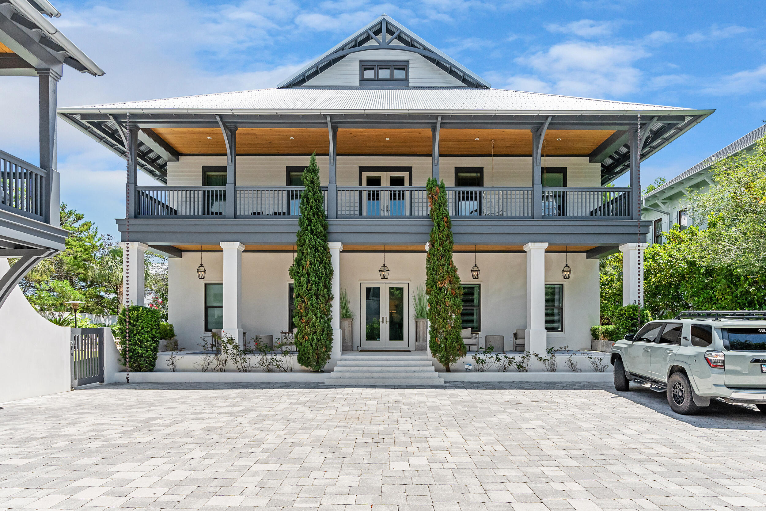 a front view of a house with garden