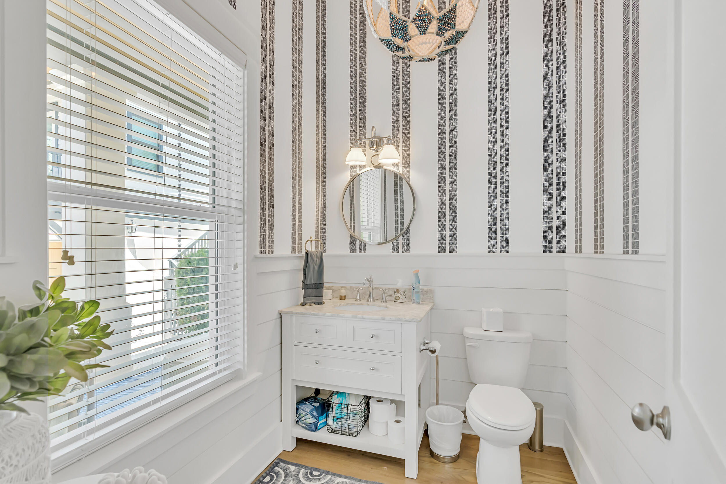 84 Pine Crest Circle Inlet Beach, FL 32461 - Photo 18 of 74 a bathroom with a sink a toilet and a mirror