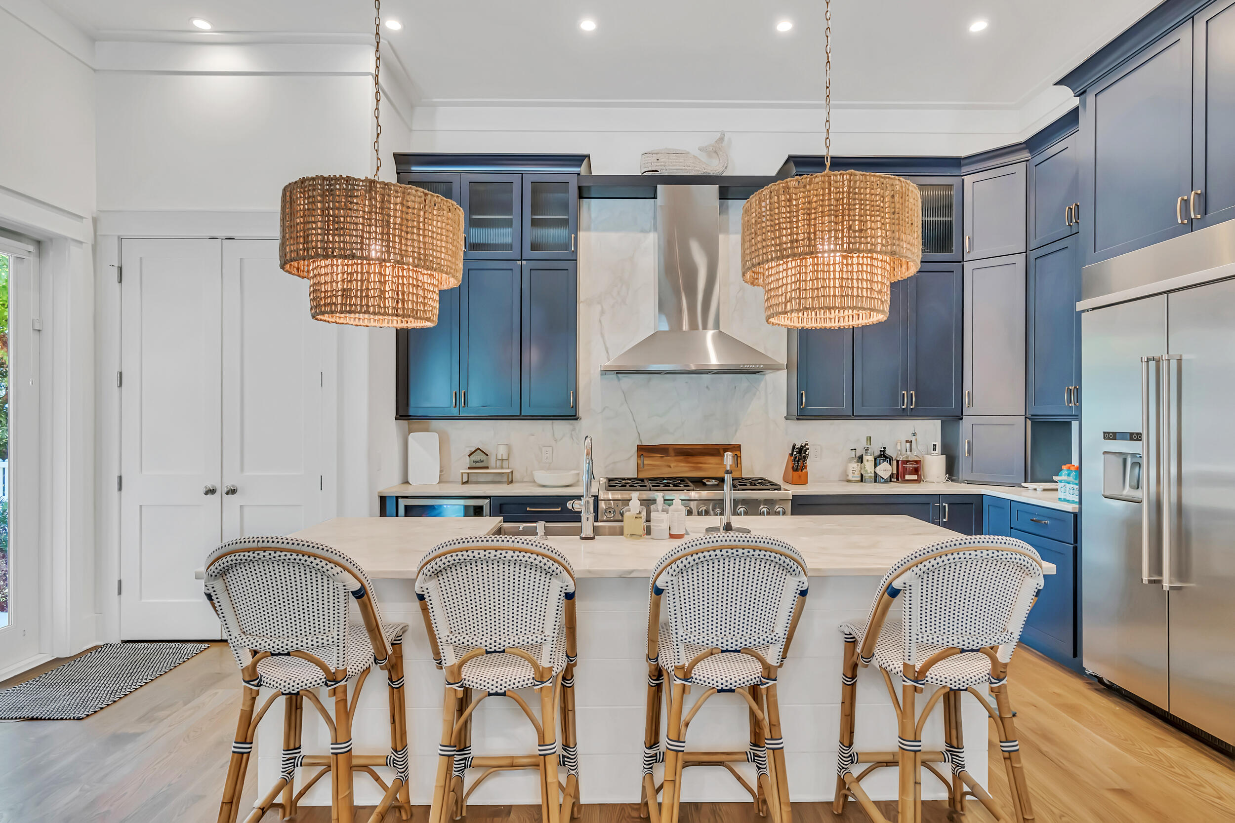 84 Pine Crest Circle Inlet Beach, FL 32461 - Photo 19 of 74 a kitchen with stainless steel appliances a sink a table and chairs in it