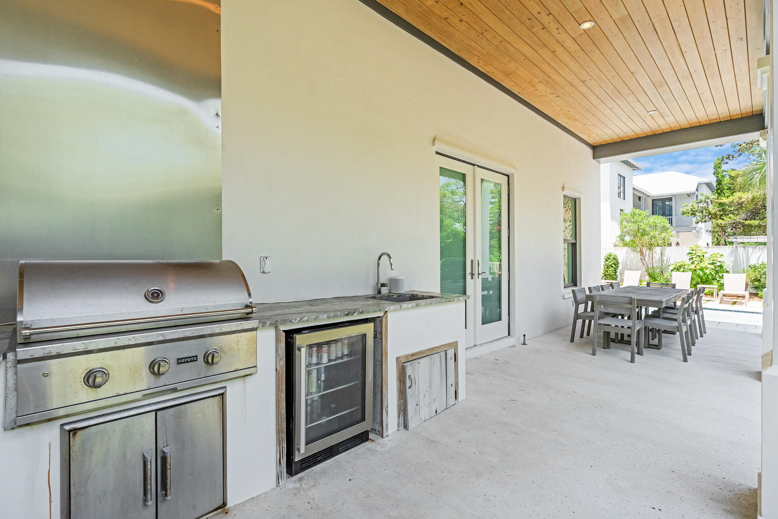 84 Pine Crest Circle Inlet Beach, FL 32461 - Photo 30 of 74 a kitchen with a stove and a table chair