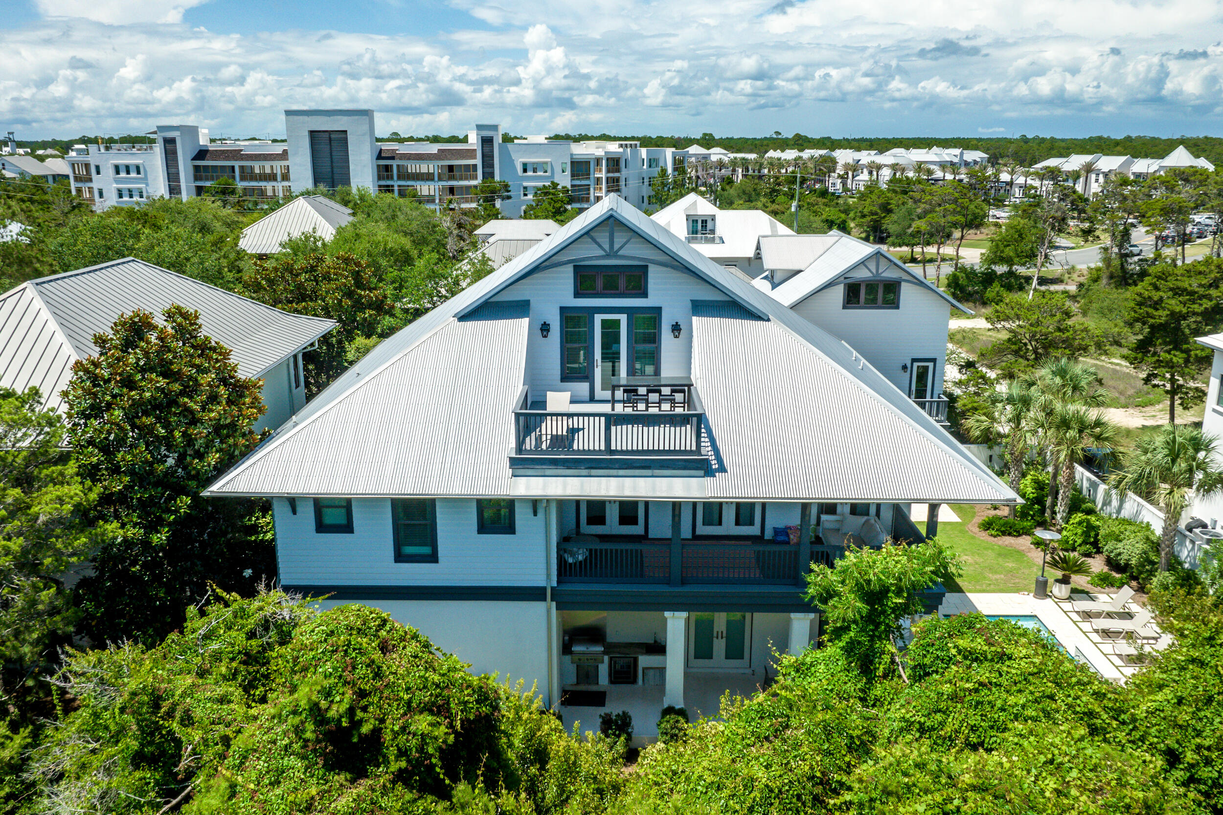 84 Pine Crest Circle Inlet Beach, FL 32461 - Photo 3 of 74 an aerial view of a house with balcony and trees al around