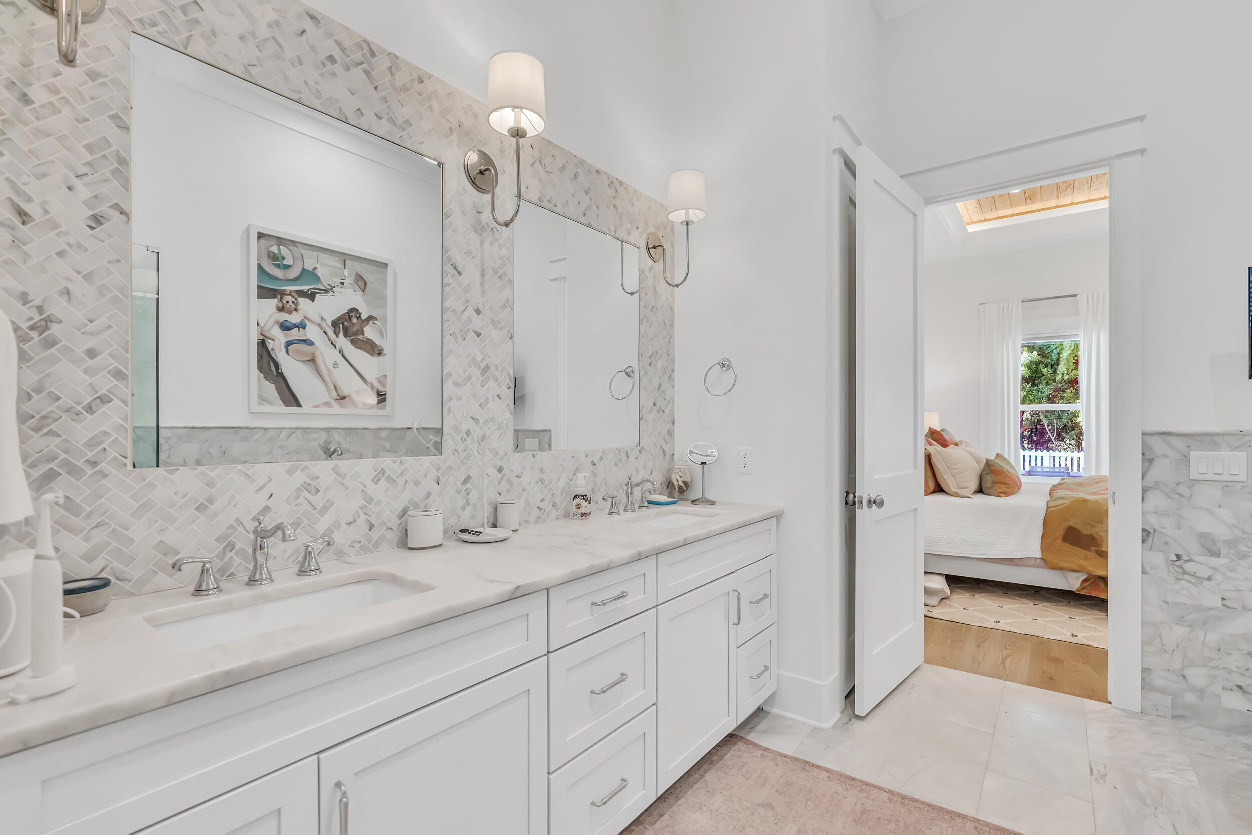 84 Pine Crest Circle Inlet Beach, FL 32461 - Photo 35 of 74 a en suite bathroom with double sink and a mirror