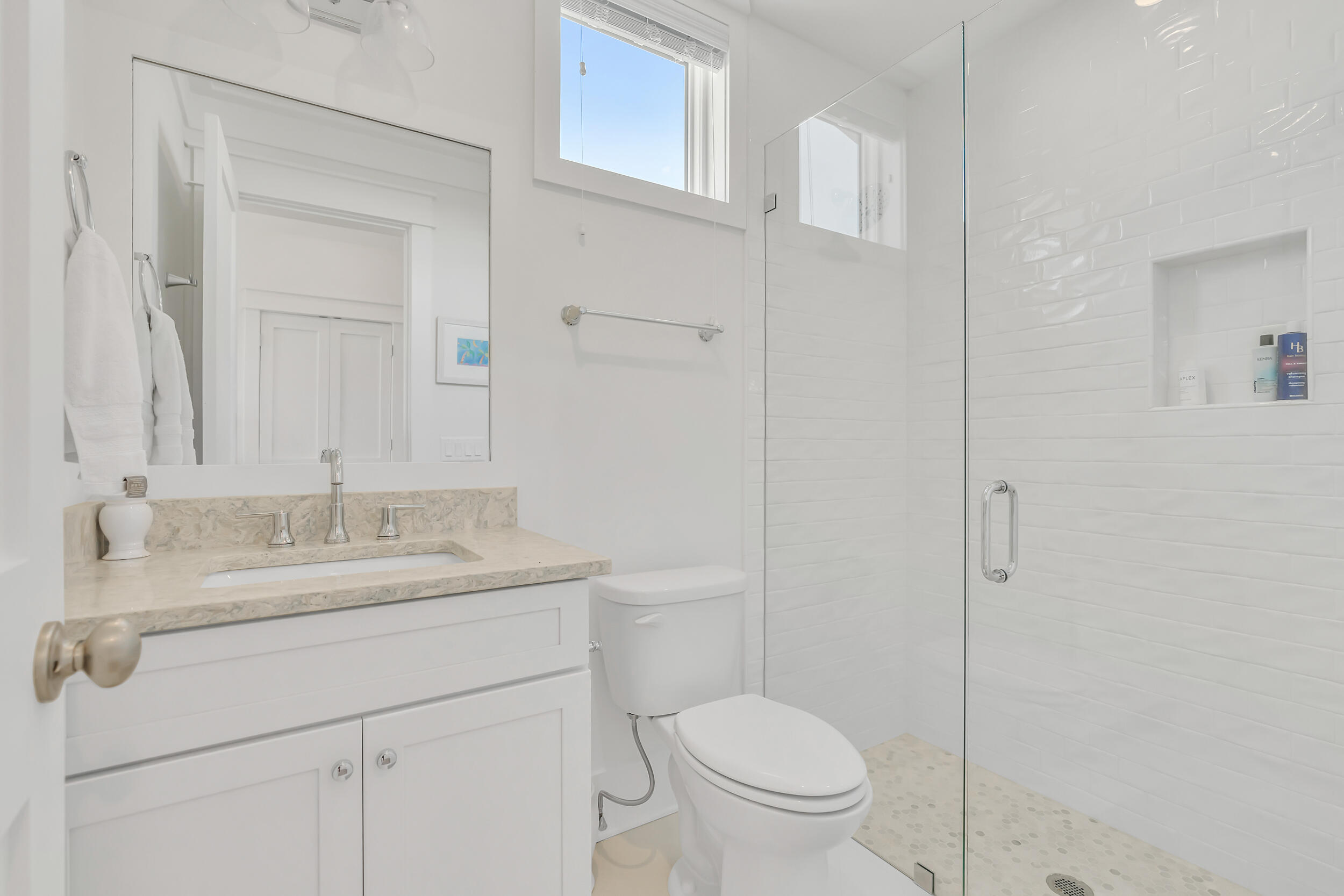 84 Pine Crest Circle Inlet Beach, FL 32461 - Photo 47 of 74 a bathroom with a granite countertop sink a toilet and a mirror