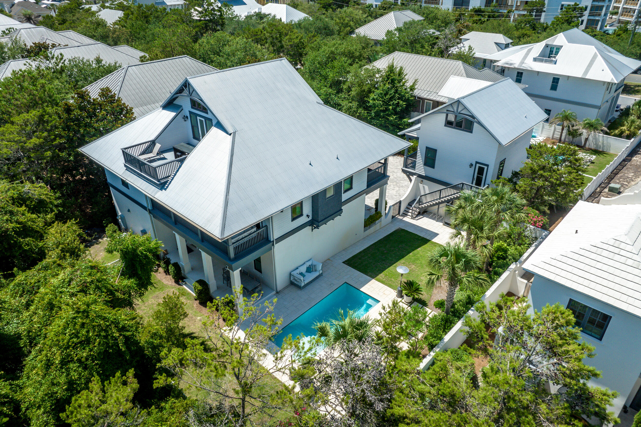 84 Pine Crest Circle Inlet Beach, FL 32461 - Photo 5 of 74 an aerial view of a house with a yard and trees