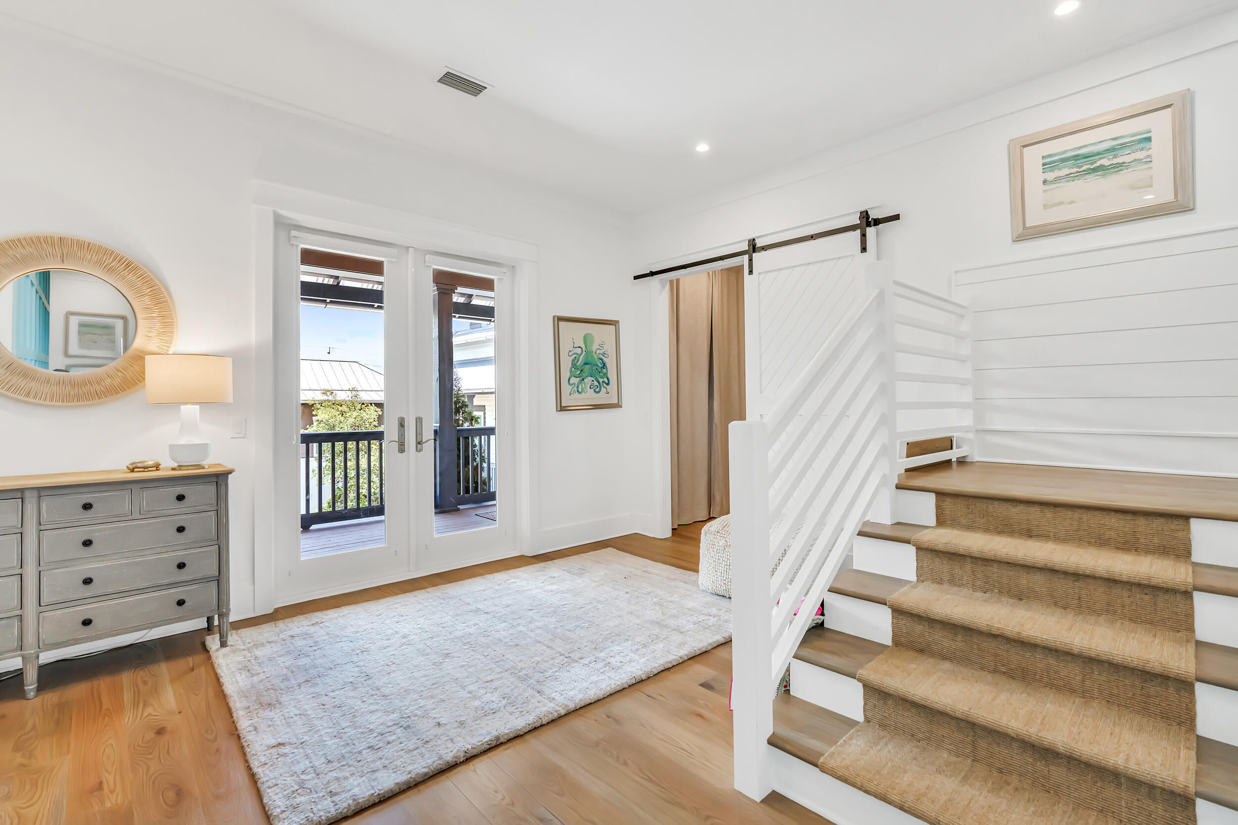 84 Pine Crest Circle Inlet Beach, FL 32461 - Photo 62 of 74 a view of an entryway with wooden floor and front door