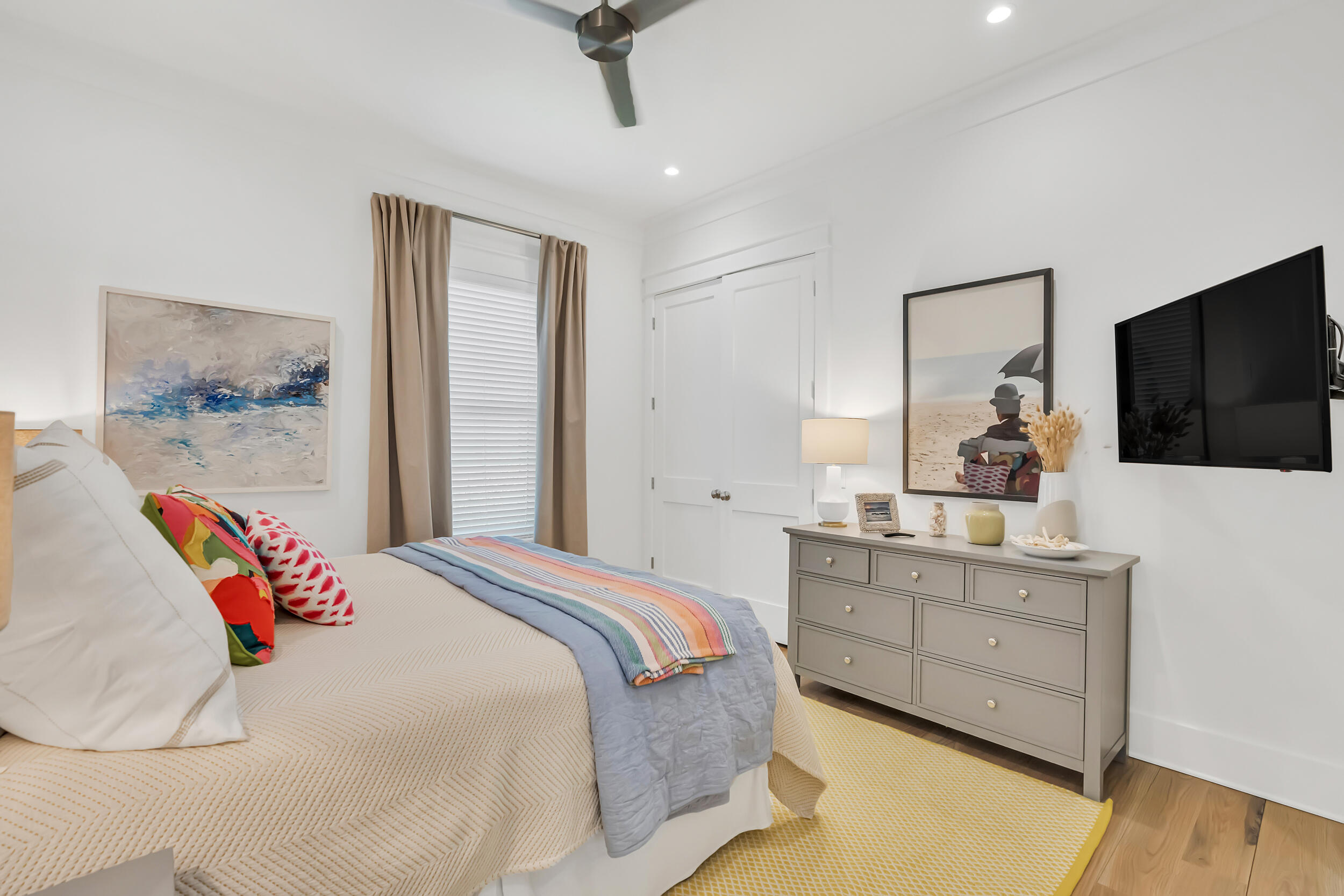 84 Pine Crest Circle Inlet Beach, FL 32461 - Photo 67 of 74 a bedroom with a large bed and a flat tv screen on dresser