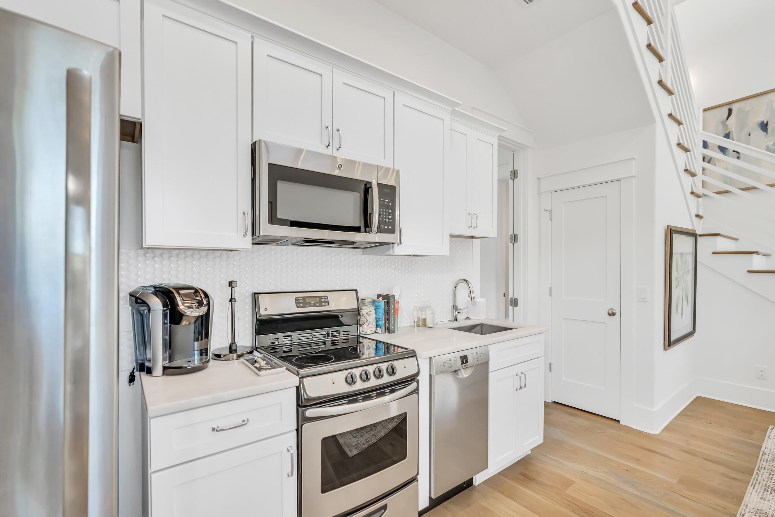 84 Pine Crest Circle Inlet Beach, FL 32461 - Photo 69 of 74 a kitchen with stainless steel appliances a stove microwave and refrigerator