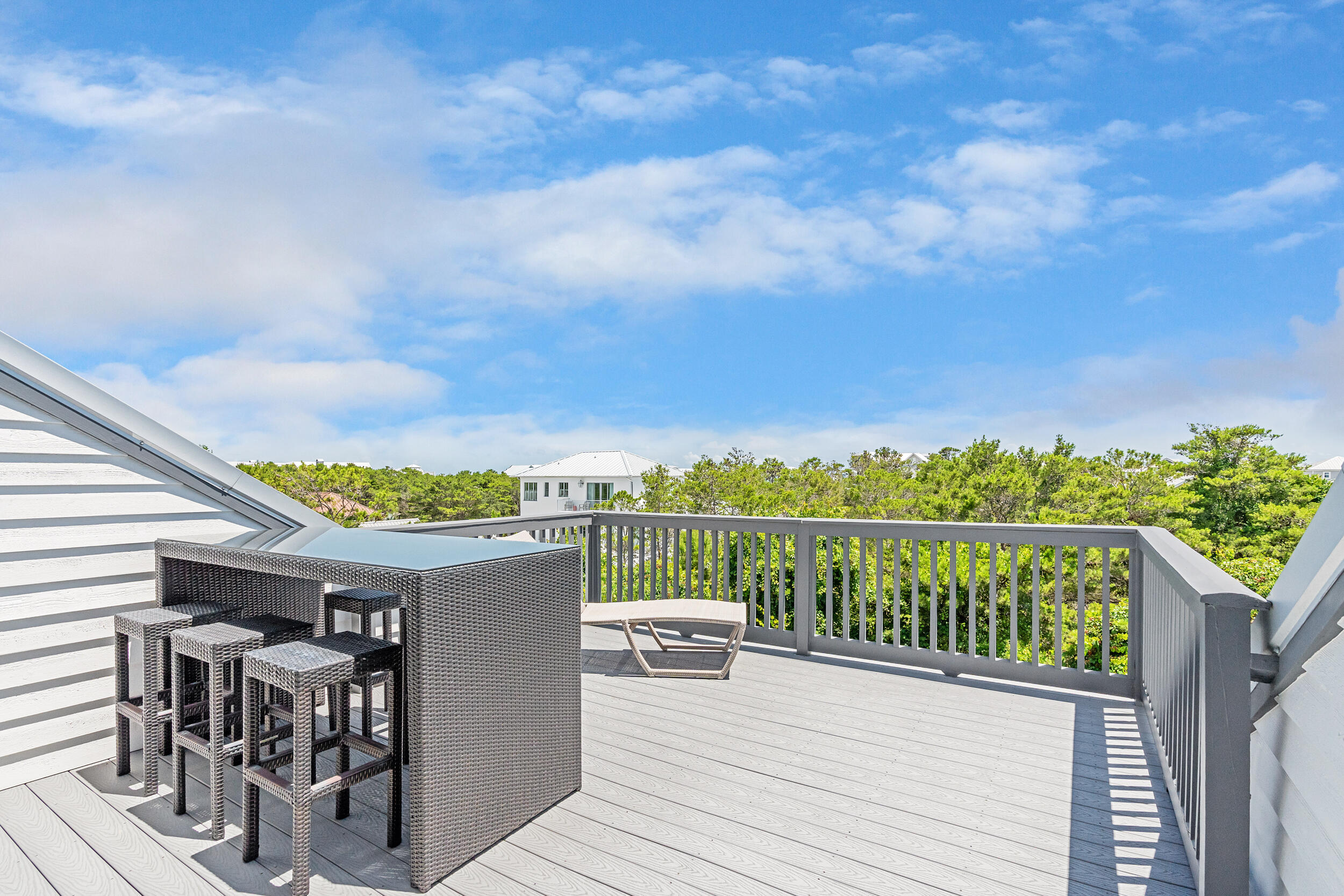 84 Pine Crest Circle Inlet Beach, FL 32461 - Photo 72 of 74 a view of a balcony with two chairs and a table