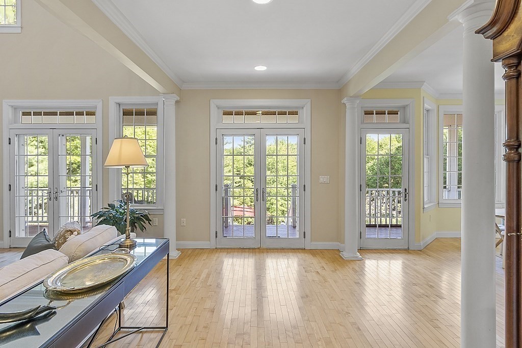 100 West Berlin Road Bolton, MA 01740 - Photo 13 of 42 a living room with furniture and two large windows