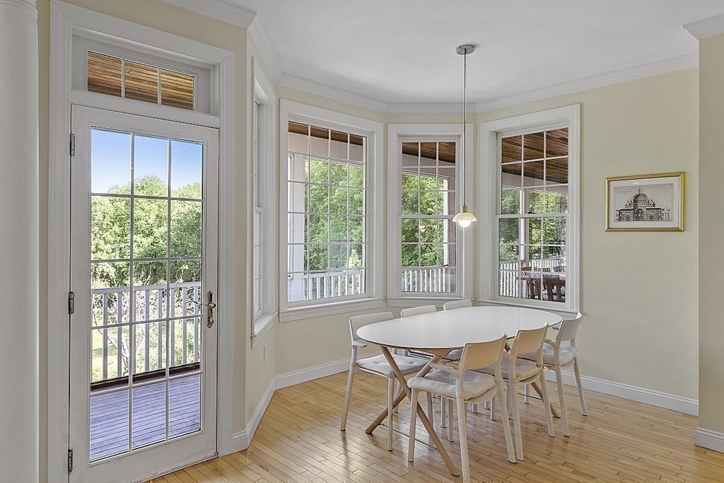 100 West Berlin Road Bolton, MA 01740 - Photo 14 of 42 a view of a dining room with furniture window and wooden floor