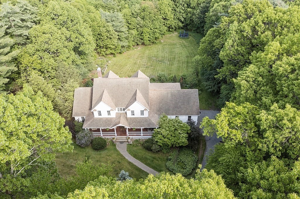 100 West Berlin Road Bolton, MA 01740 - Photo 2 of 42 an aerial view of a house with a yard and lake view