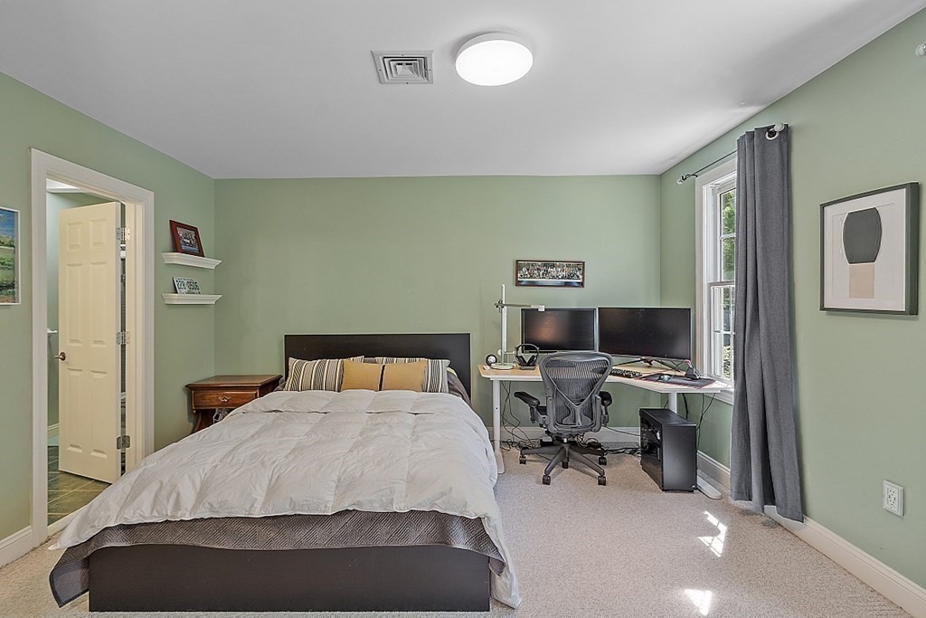 100 West Berlin Road Bolton, MA 01740 - Photo 28 of 42 a bedroom with a bed and a desk