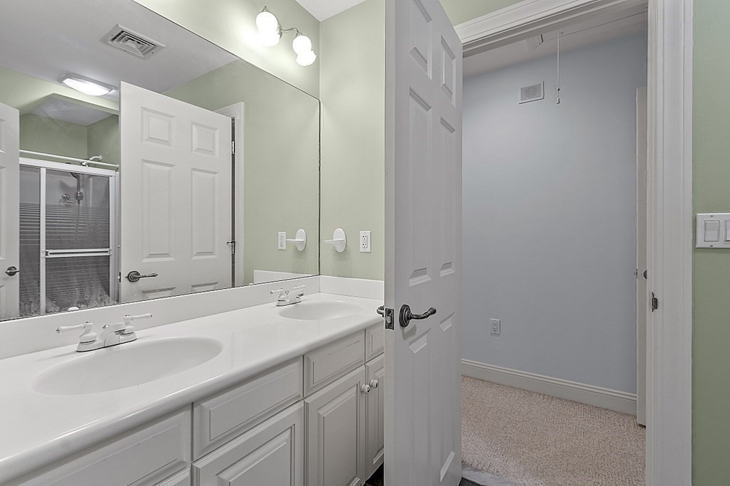 100 West Berlin Road Bolton, MA 01740 - Photo 29 of 42 a bathroom with a double vanity sink mirror and double