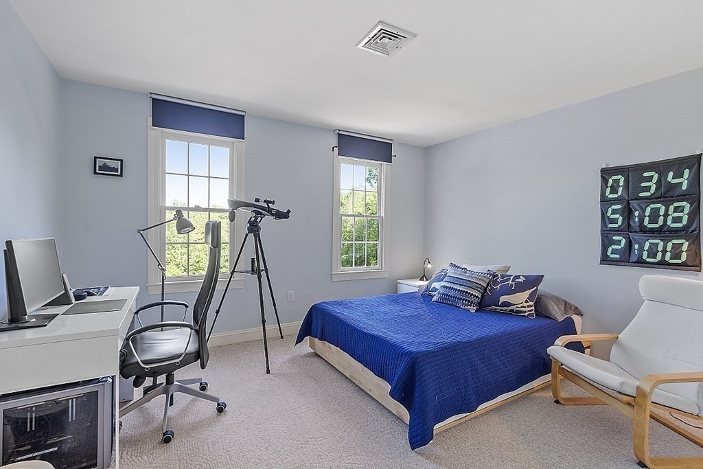 100 West Berlin Road Bolton, MA 01740 - Photo 30 of 42 a bedroom with furniture and a window
