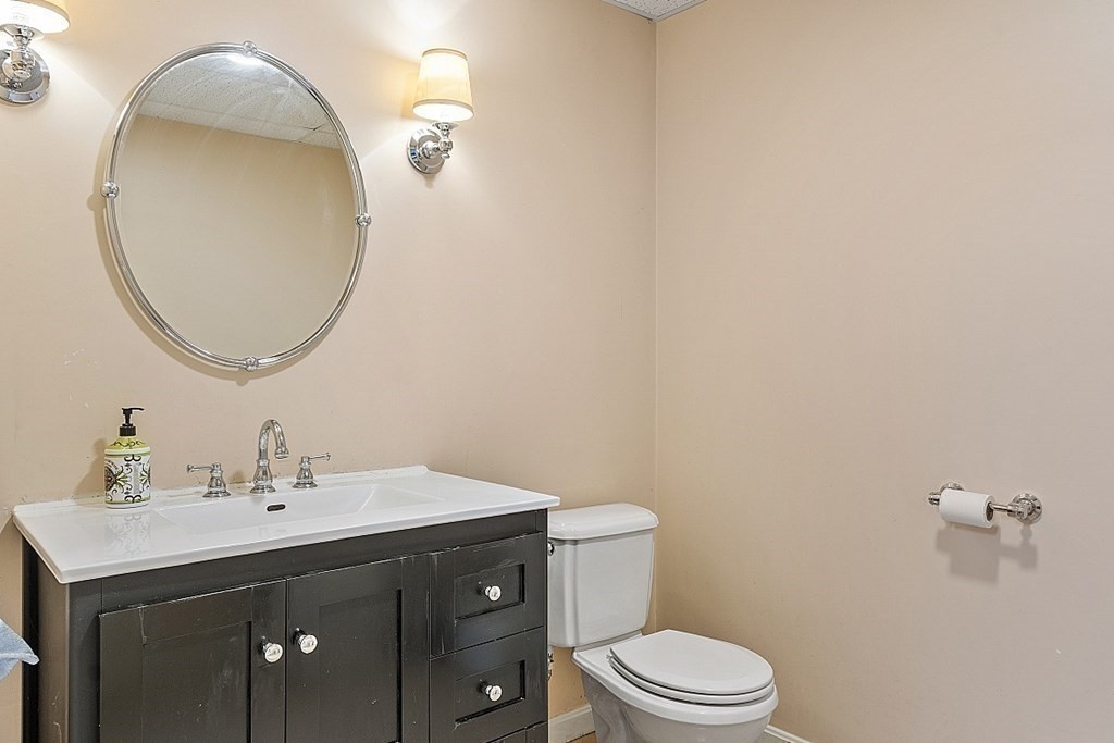 100 West Berlin Road Bolton, MA 01740 - Photo 32 of 42 a bathroom with a sink vanity mirror and toilet