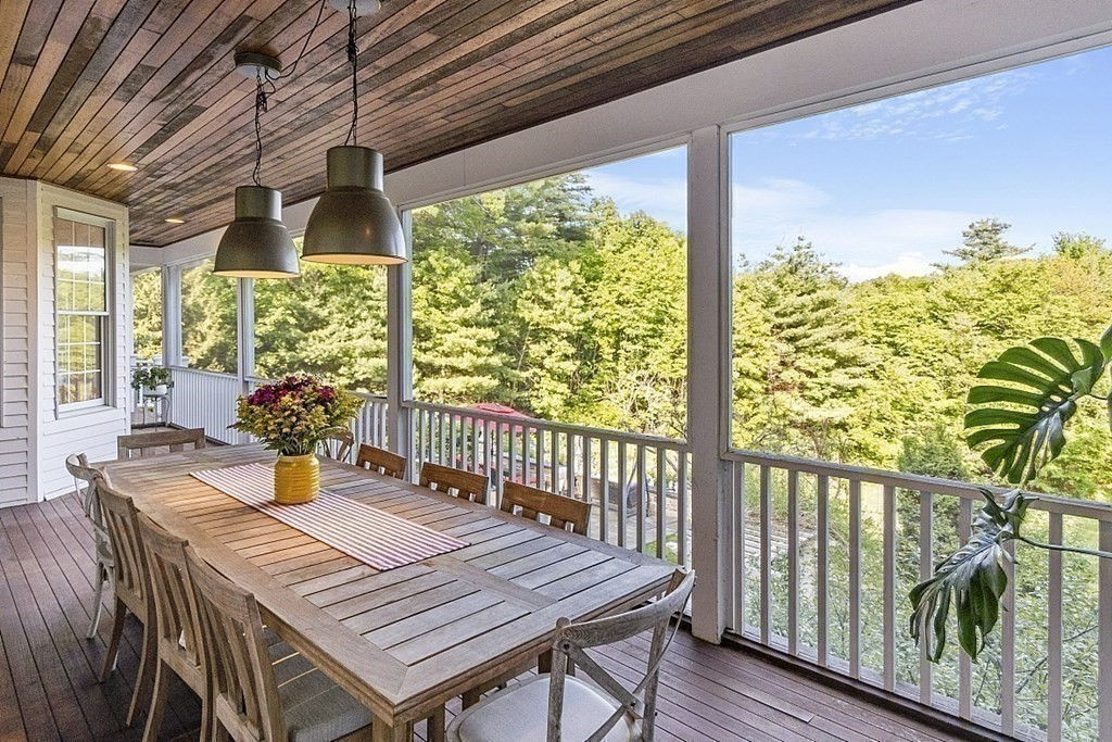 100 West Berlin Road Bolton, MA 01740 - Photo 33 of 42 a view of a balcony dining table and chairs