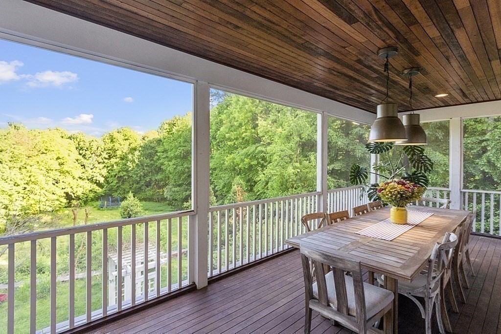 100 West Berlin Road Bolton, MA 01740 - Photo 34 of 42 a view of a patio with a table chairs and a table
