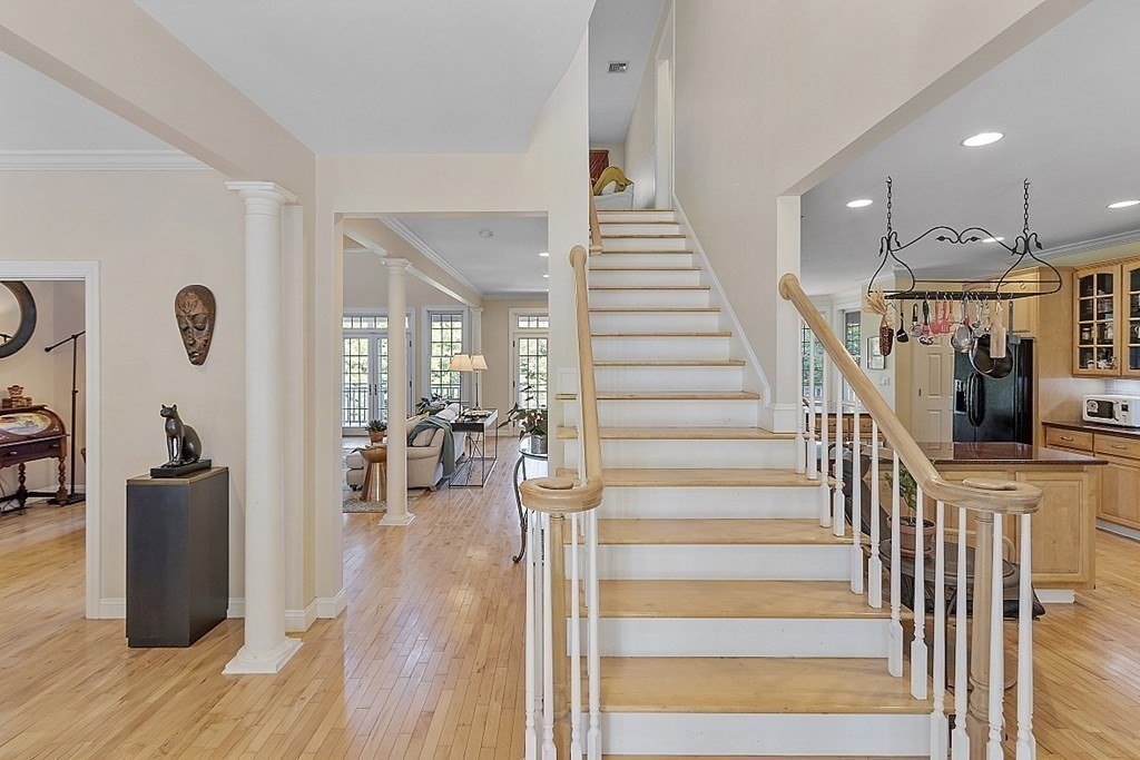 100 West Berlin Road Bolton, MA 01740 - Photo 5 of 42 a view of entryway and hall with wooden floor
