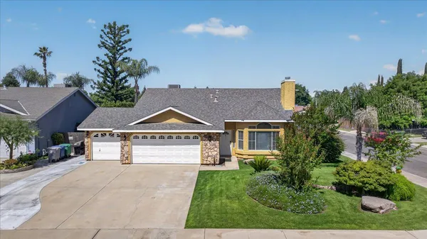 a house view with a garden space