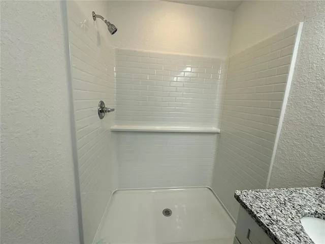 a bathroom with a bath tub