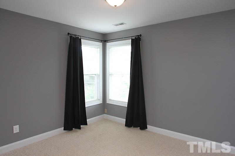 7332 Denlee Road Raleigh, NC 27603 - Photo 11 of 24 an empty room with windows