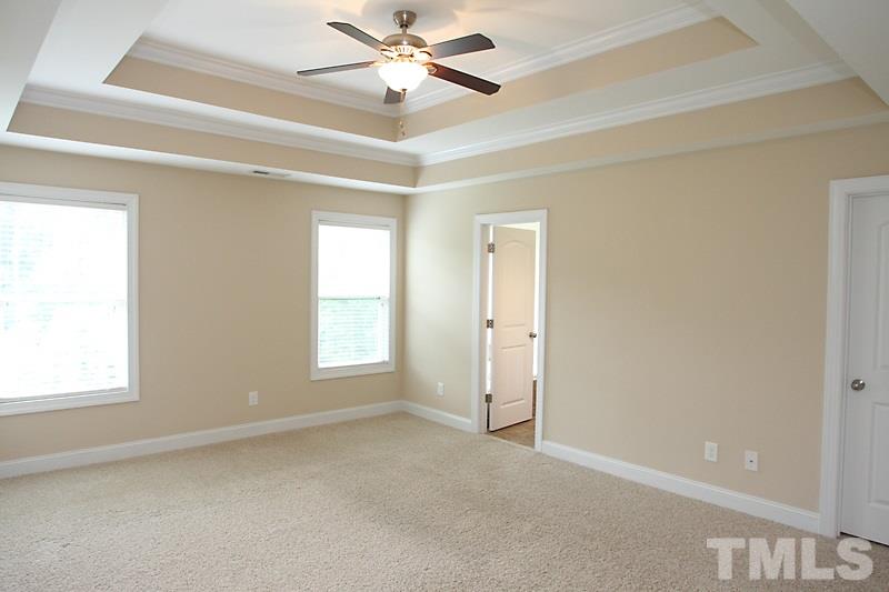 7332 Denlee Road Raleigh, NC 27603 - Photo 14 of 24 a view of an empty room with a window