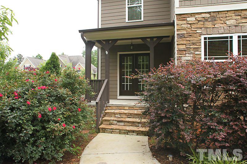 7332 Denlee Road Raleigh, NC 27603 - Photo 3 of 24 a front view of a house with plants