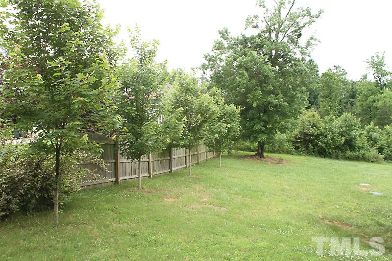 7332 Denlee Road Raleigh, NC 27603 - Photo 21 of 24 a view of an outdoor space and a yard