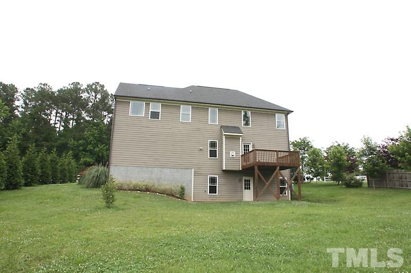7332 Denlee Road Raleigh, NC 27603 - Photo 24 of 24 a view of a house with a yard and sitting area