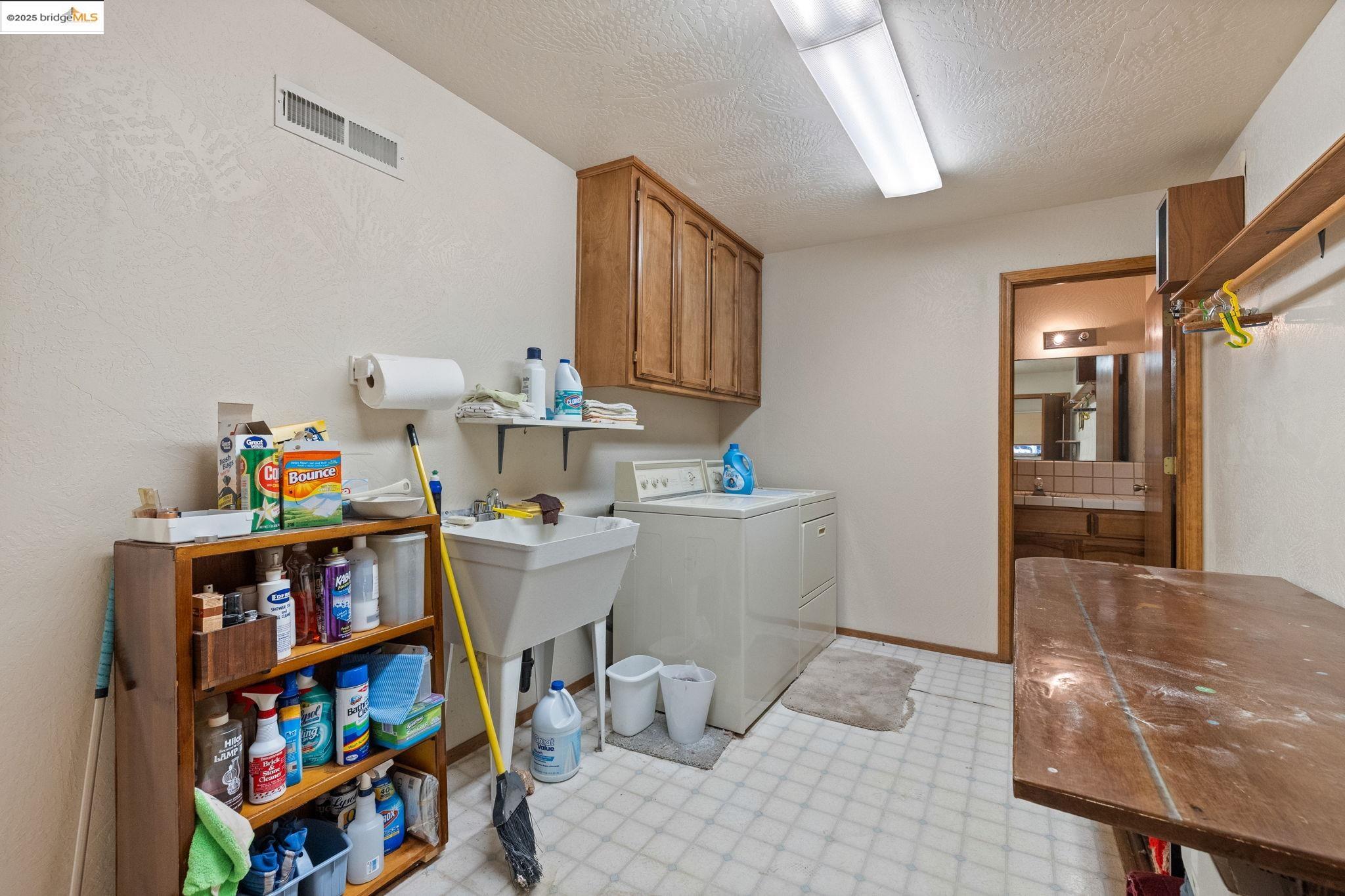 12087 Breckenridge Road Groveland, CA 95321 - Photo 18 of 31 a storage room with wooden floor and furniture
