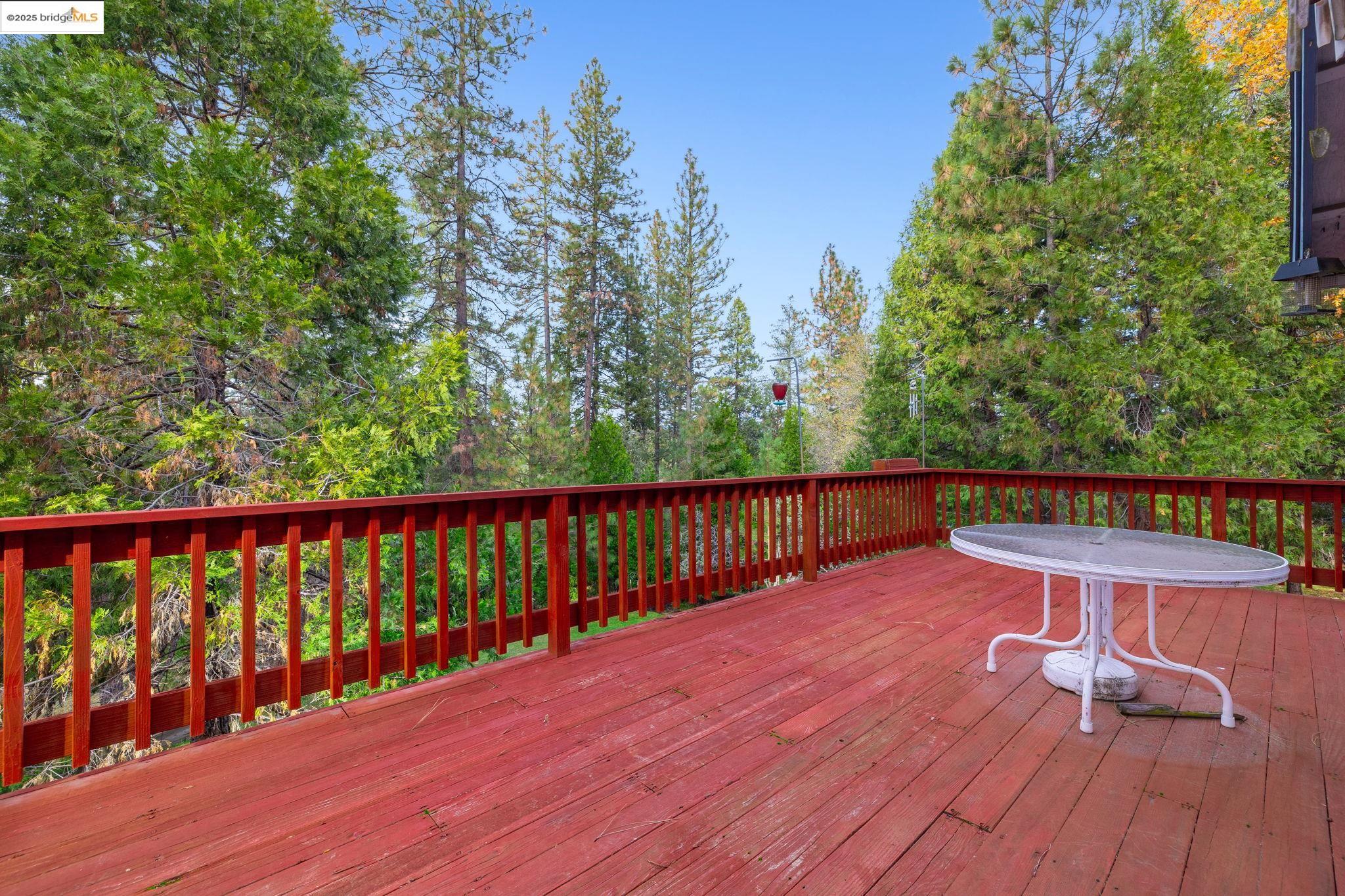12087 Breckenridge Road Groveland, CA 95321 - Photo 21 of 31 a balcony with wooden floor and outdoor space