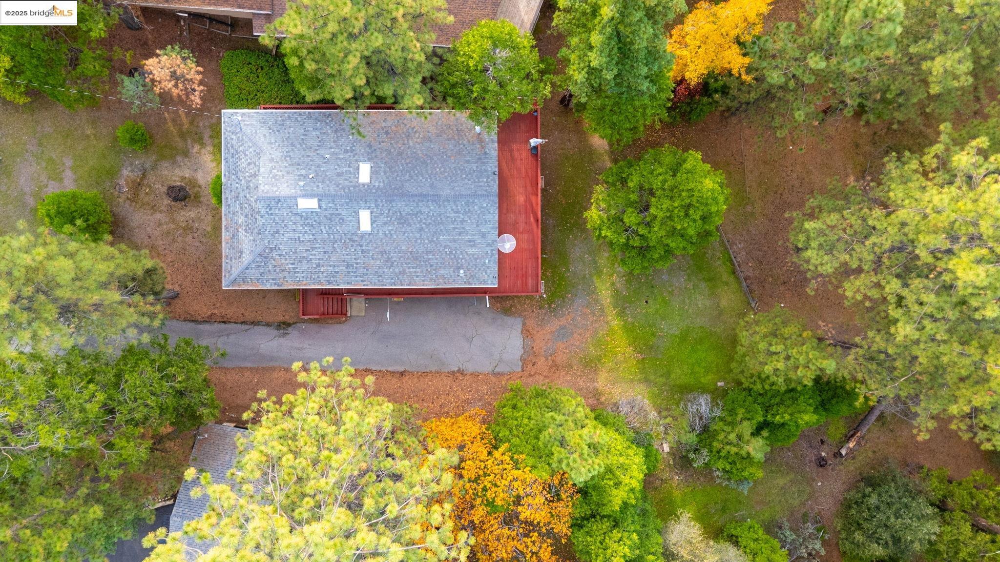 12087 Breckenridge Road Groveland, CA 95321 - Photo 26 of 31 an aerial view of a house with swimming pool and garden