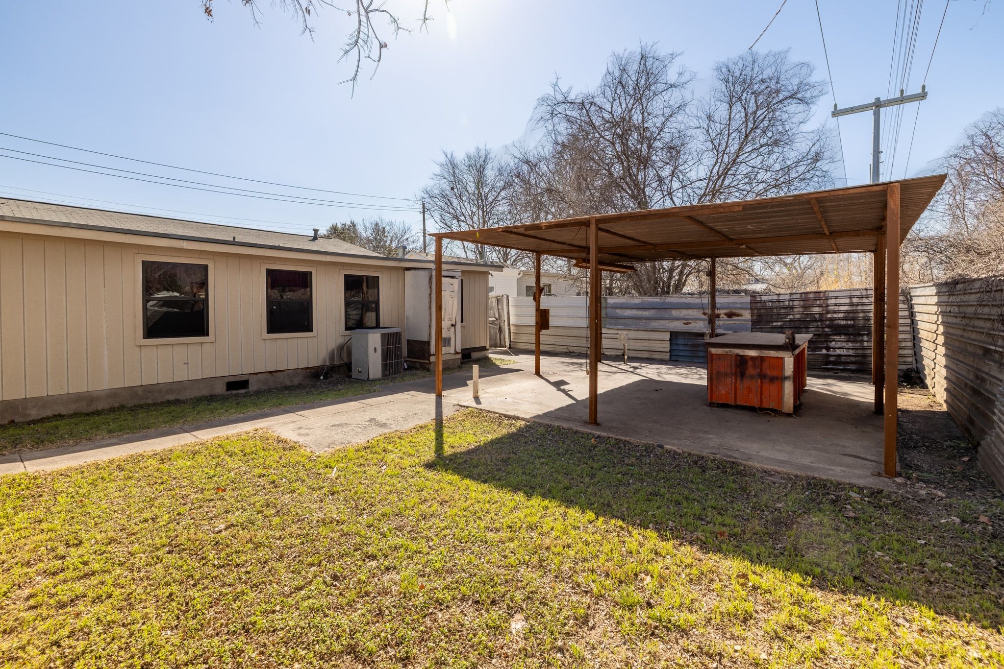 1114 Richardine Avenue Austin, TX 78721 - Photo 25 of 27 a backyard of a house with barbeque oven table and chairs