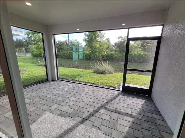 a view of a room with porch and a yard