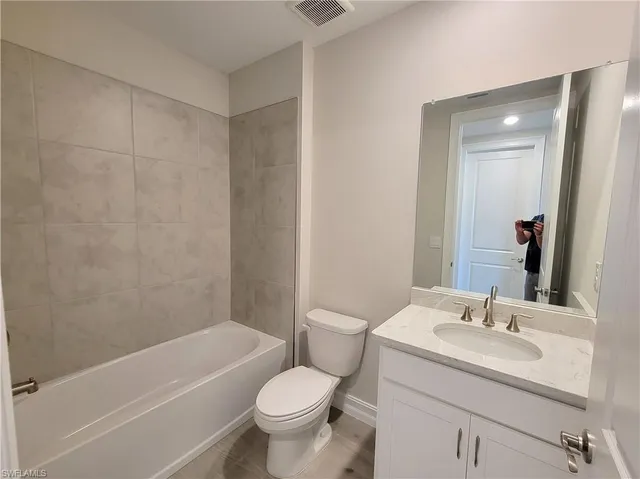 a bathroom with a sink toilet and bathtub