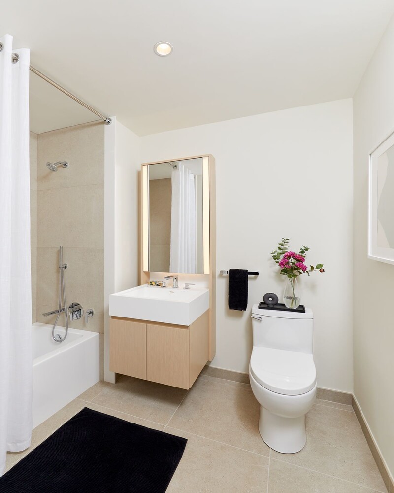 7 Dey Street, Unit 14A Manhattan, NY 10007 - Photo 5 of 17 a bathroom with a sink a toilet and shower