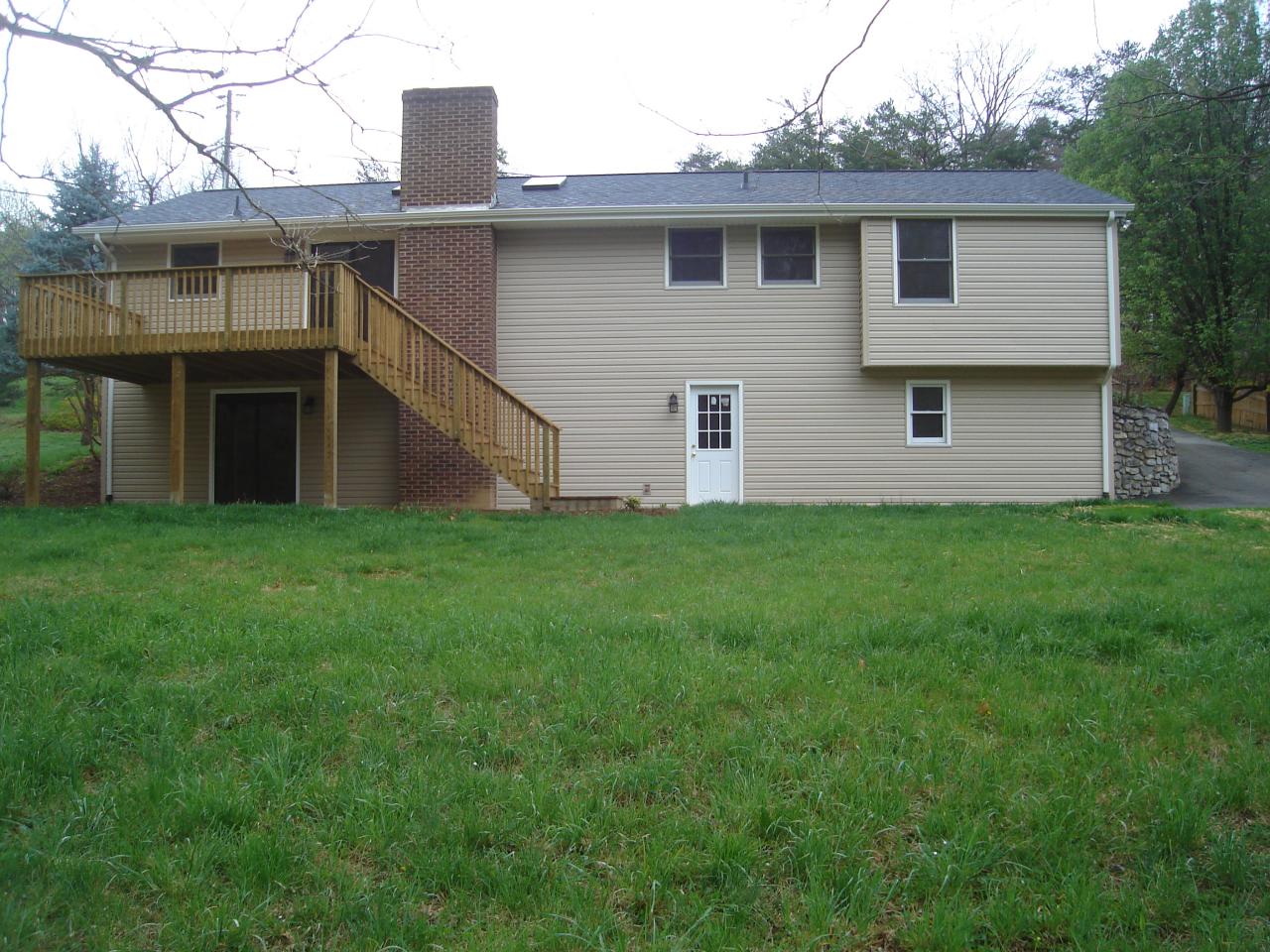 1109 Mountain Pass Road Blue Ridge, VA 24064 - Photo 7 of 18 a view of a house with a yard