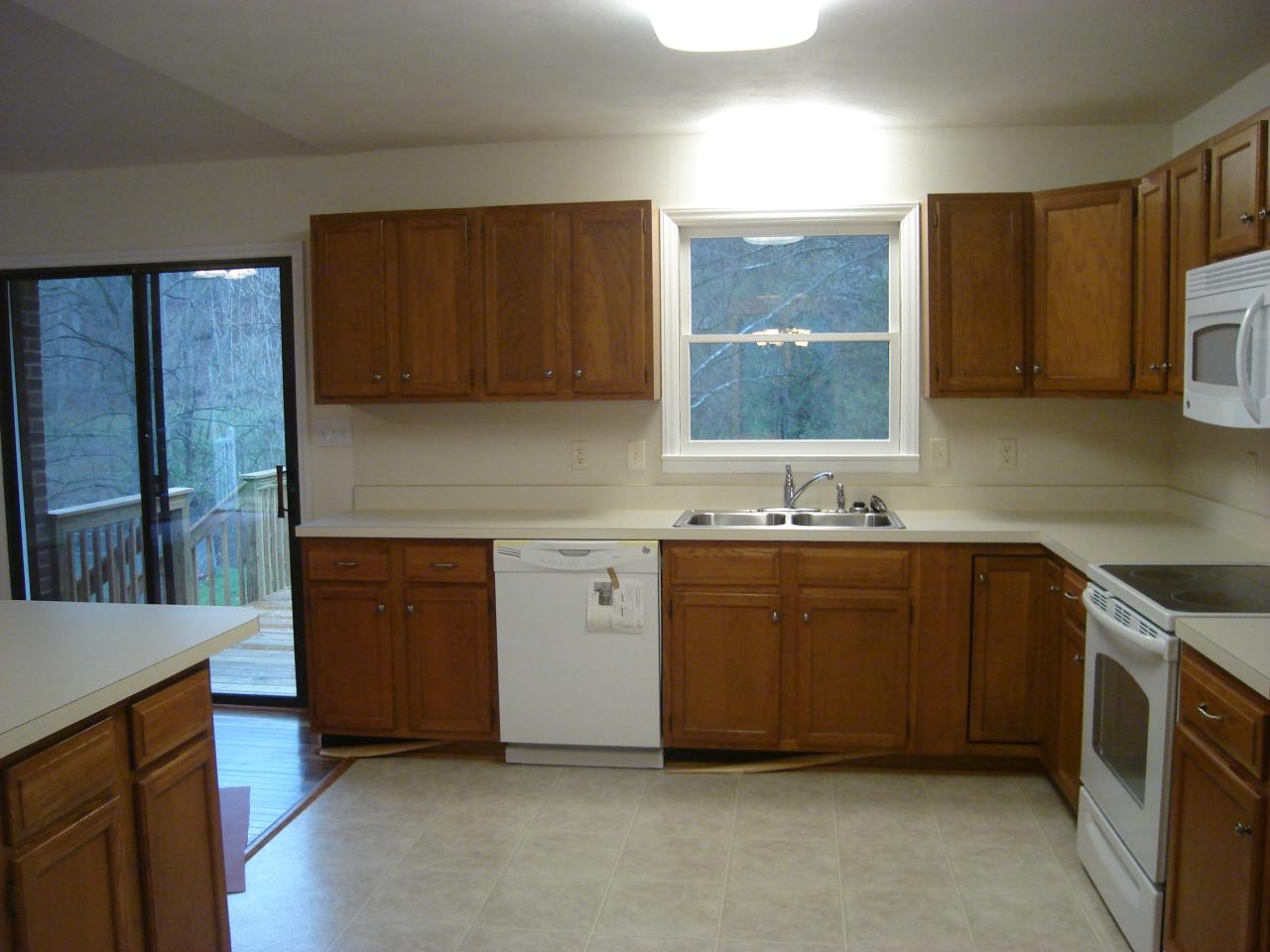 1109 Mountain Pass Road Blue Ridge, VA 24064 - Photo 10 of 18 a kitchen with granite countertop a sink stainless steel appliances and cabinets