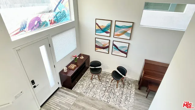 a view of an entryway with wooden floor