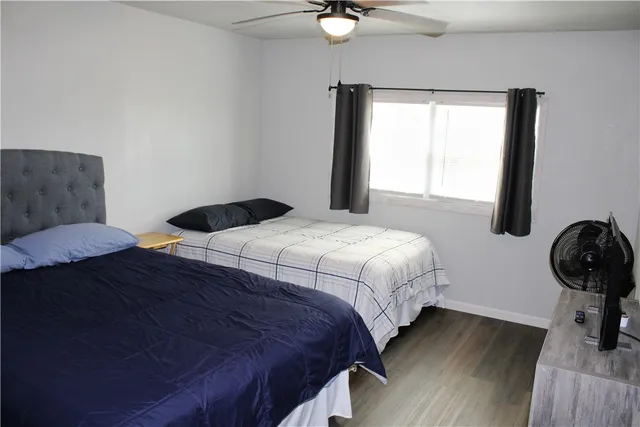 a bedroom with a bed and window