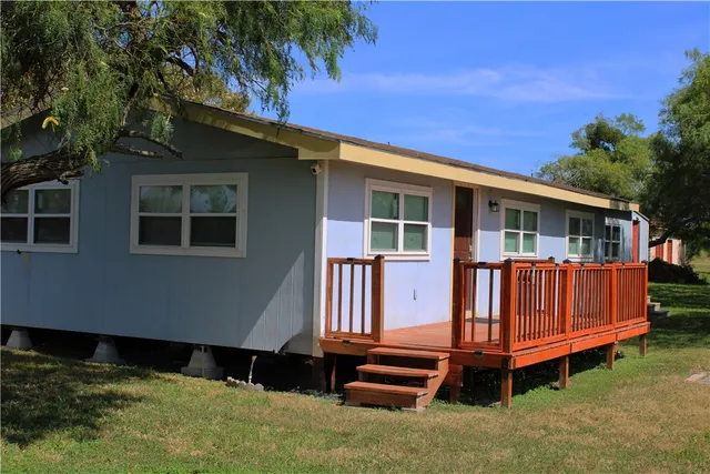 a view of backyard with deck