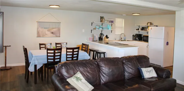 a view of kitchen with cabinets and wooden floor