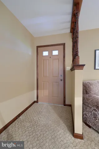 a view of livingroom with furniture and front door