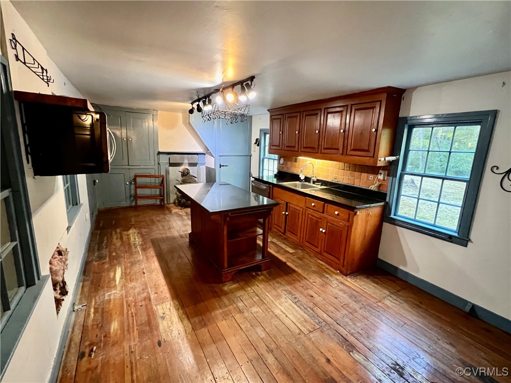 11075 Buckley Hall Road Mathews, VA 23109 - Photo 11 of 38 a kitchen with sink cabinets and wooden floor