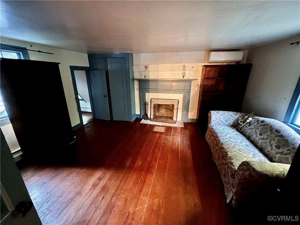 11075 Buckley Hall Road Mathews, VA 23109 - Photo 16 of 38 a living room with furniture and a fireplace