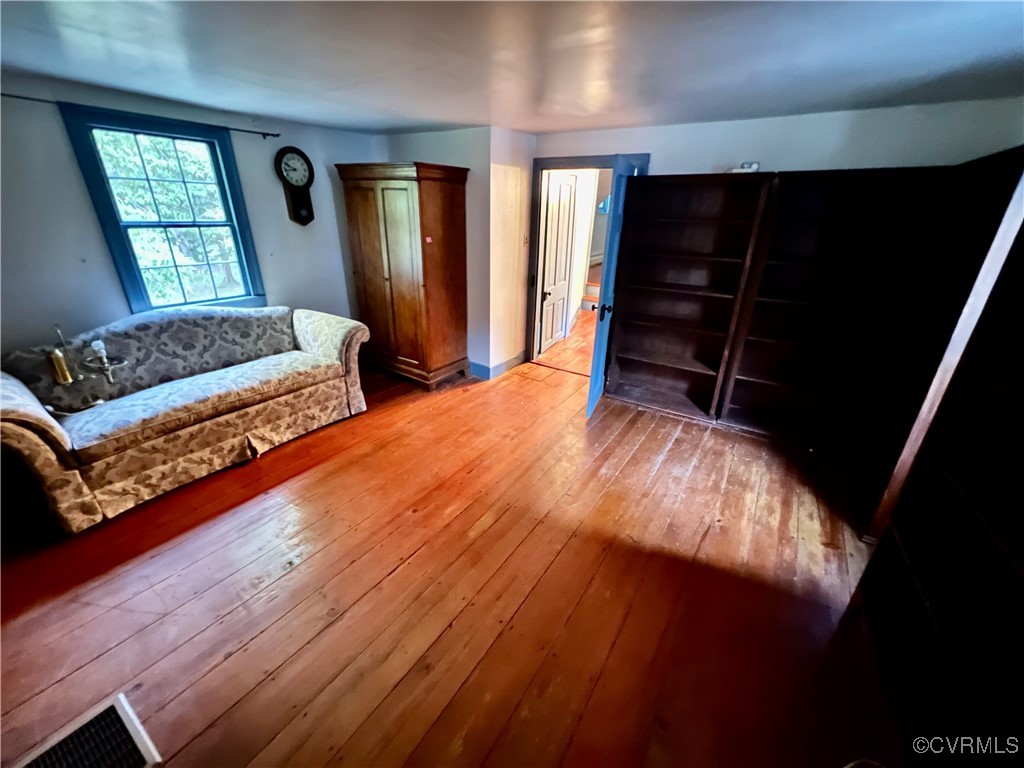 11075 Buckley Hall Road Mathews, VA 23109 - Photo 17 of 38 a bedroom with double bed and a window