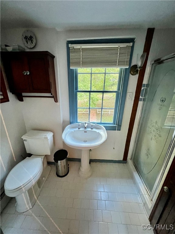 11075 Buckley Hall Road Mathews, VA 23109 - Photo 18 of 38 a bathroom with a toilet a sink and a mirror